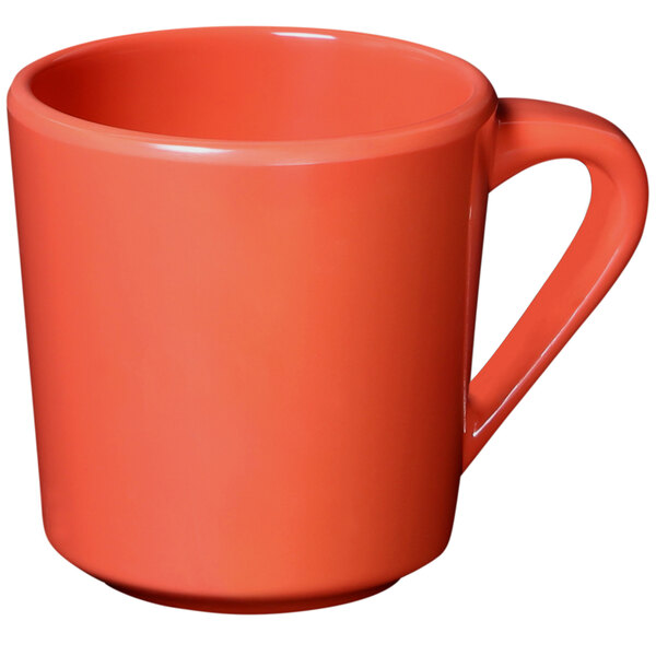 An orange Elite Global Solutions melamine mug with a handle.