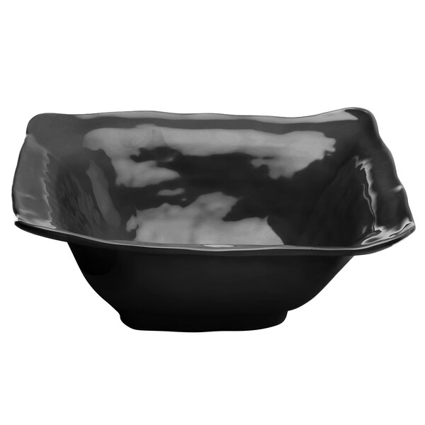 A black square melamine bowl with a curved edge.