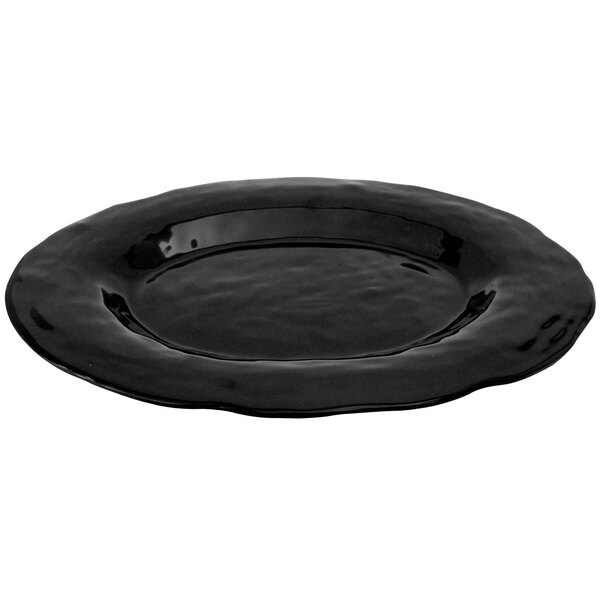 A black oval melamine platter with a wavy rim.