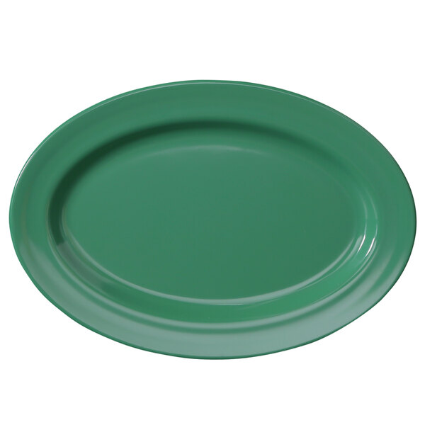 A green oval melamine platter with a white surface.