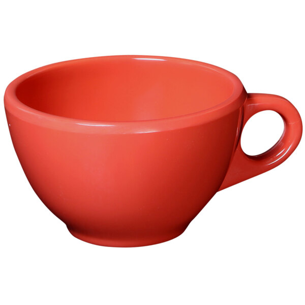A close-up of a red Elite Global Solutions melamine coffee cup with a handle.