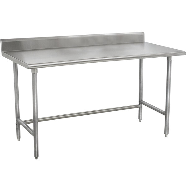 An Advance Tabco stainless steel work table with a stainless steel top.