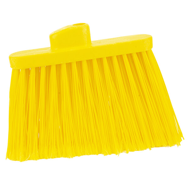 A close up of a yellow broom head with yellow flagged bristles.