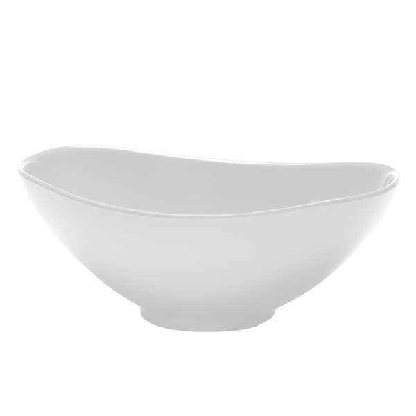 A white Elite Global Solutions melamine oval bowl with a curved edge.