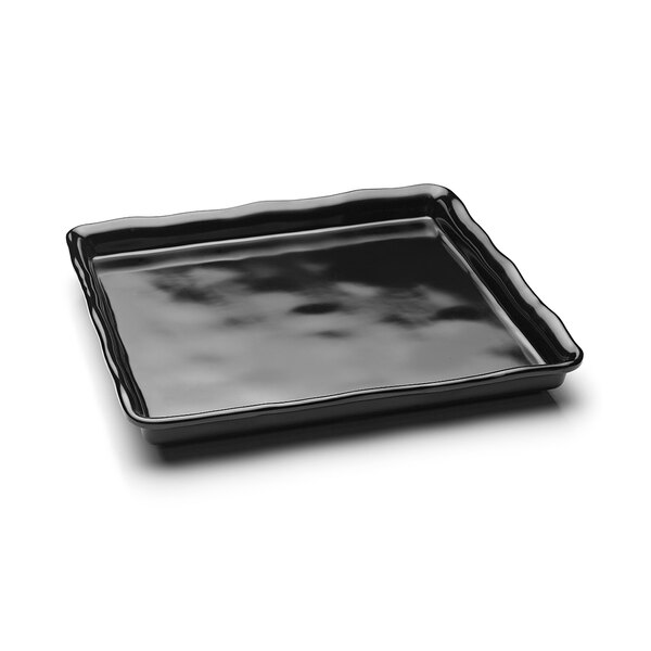 A black rectangular melamine tray with a wavy organic edge.