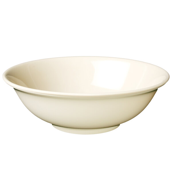 A tan Thunder Group Nustone melamine bowl with no rim on a white background.