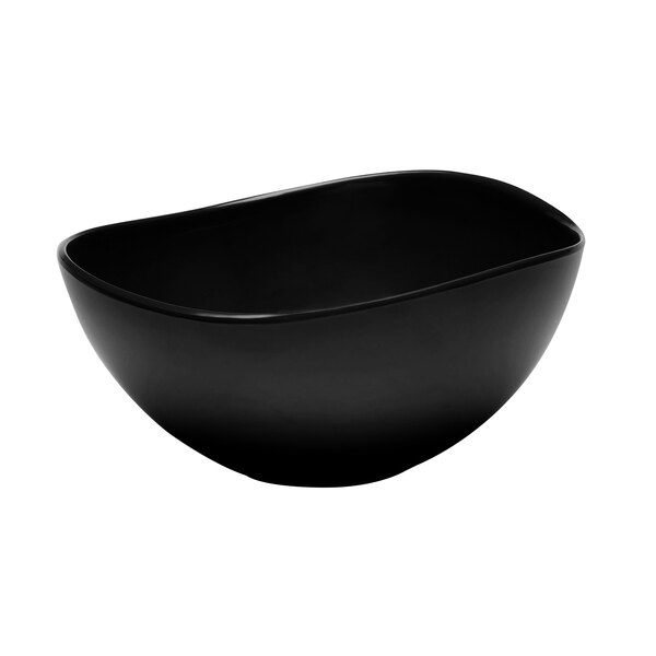 An Elite Global Solutions black melamine bowl that is almost oval.