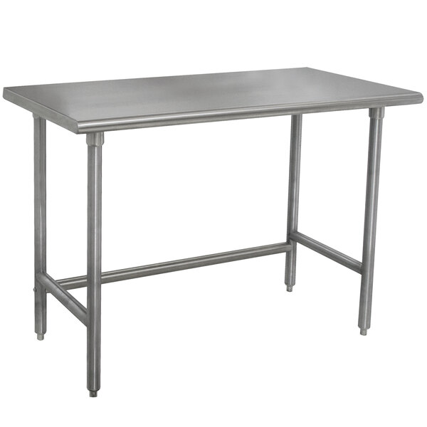 A silver rectangular Advance Tabco stainless steel work table with metal legs.