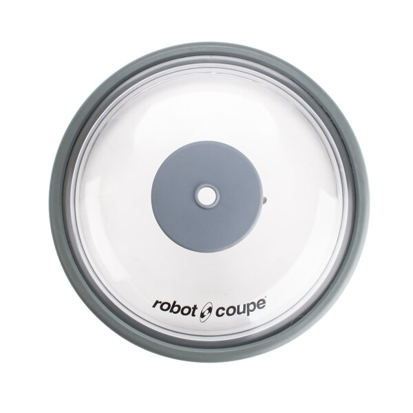 A white Robot Coupe lid with a grey disc and round seal in the middle.