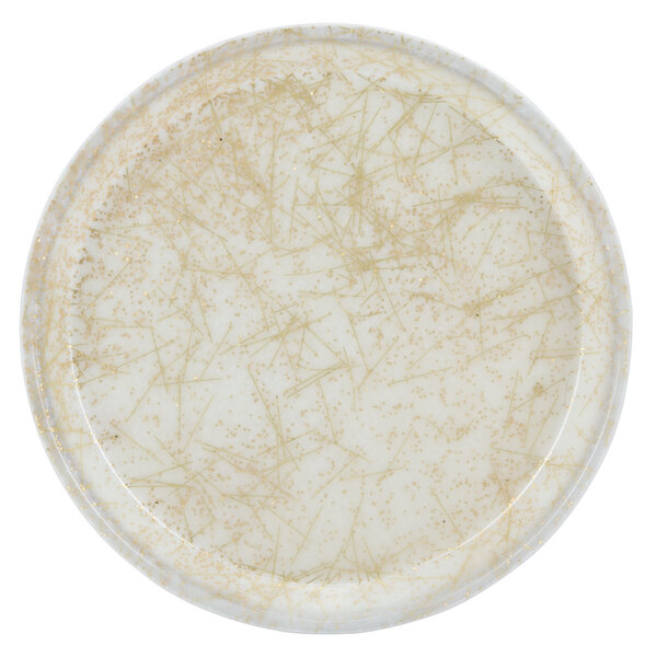 A white plate with a gold speckled pattern on it.