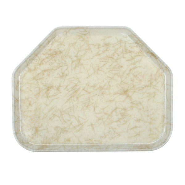 A white Cambro trapezoid tray with a beige and brown pattern.