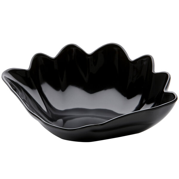 A black melamine bowl with a wavy edge.