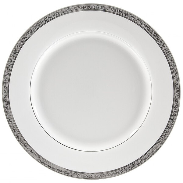A white porcelain charger plate with a silver border.
