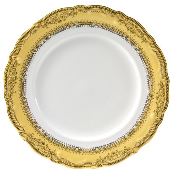 A white porcelain charger plate with a gold border.