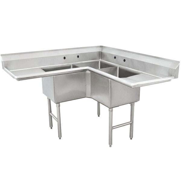 A stainless steel Advance Tabco three compartment sink with two drainboards on a counter.