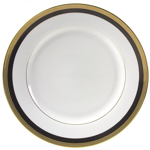 A white porcelain charger plate with gold trim.