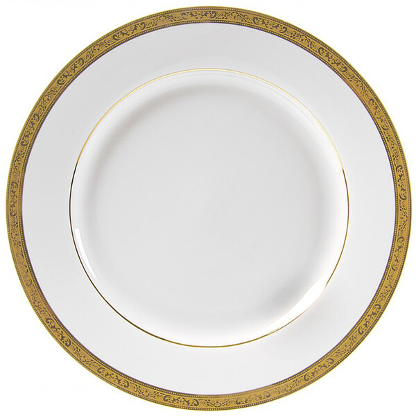 A white porcelain charger plate with gold trim and a gold rim.