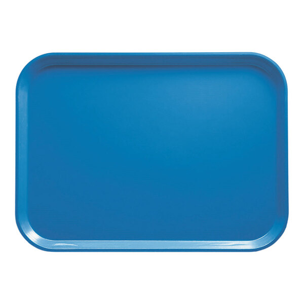 A blue Cambro rectangular fiberglass tray on a school kitchen counter.