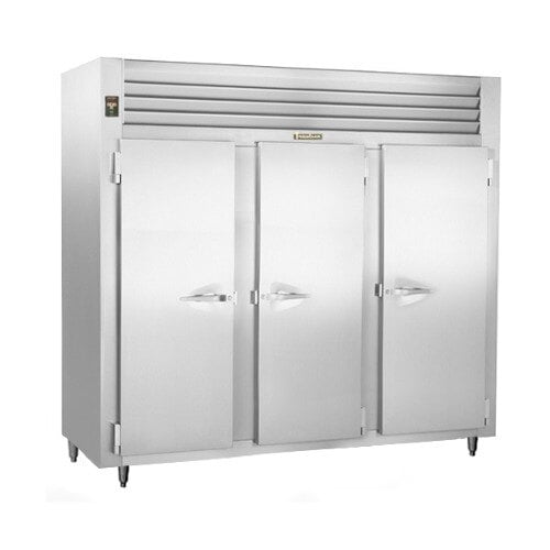 The stainless steel Traulsen three-section reach-in freezer with solid doors.