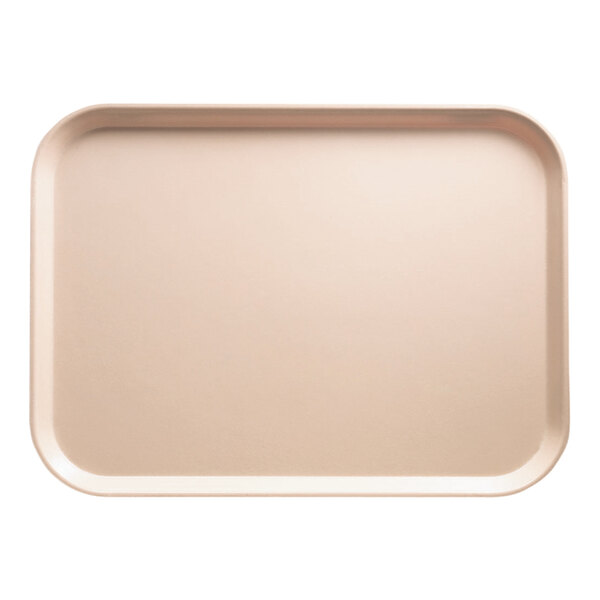 A rectangular light peach Cambro cafeteria tray.