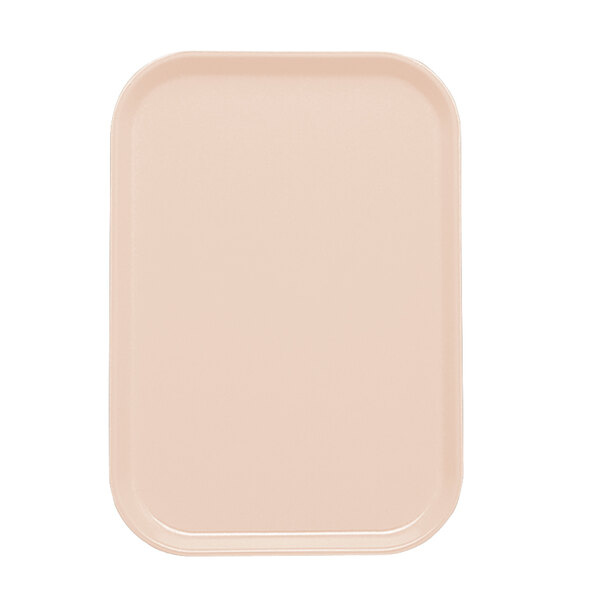 A light peach rectangular insert for a Cambro tray.