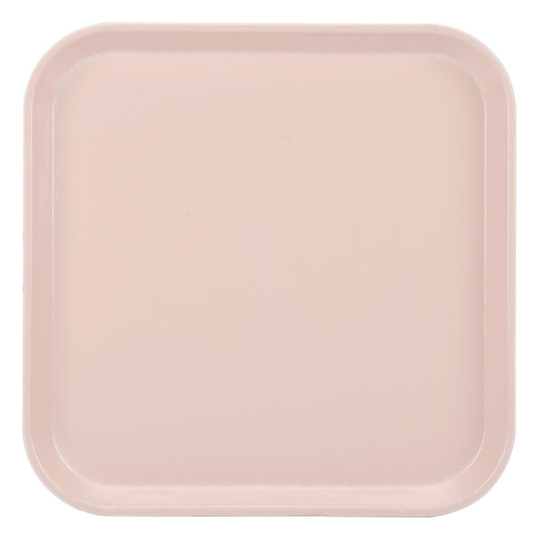 A square light pink Cambro tray.
