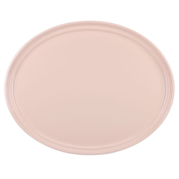 A light peach oval Cambro tray on a white background.