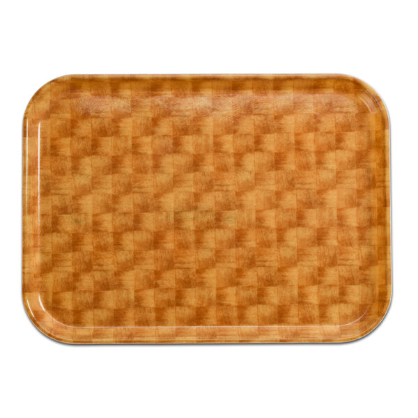 A brown rectangular Cambro tray with a basketweave pattern on a wood surface.