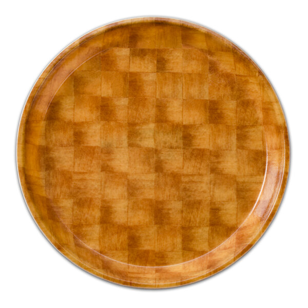 A close-up of a Cambro round fiberglass tray with a light basketweave pattern.