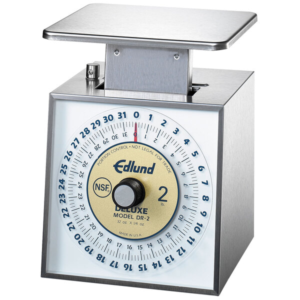 An Edlund portion scale with a dial on a counter in a deli.