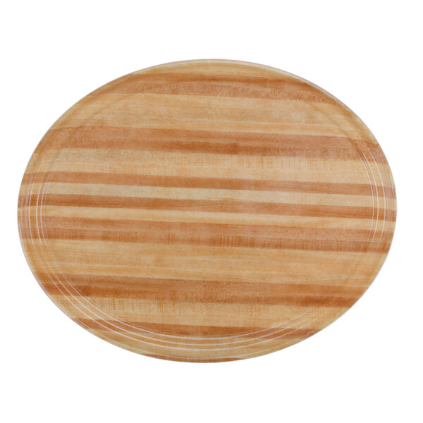 A light wooden oval Cambro butcher block tray with a stripe pattern.