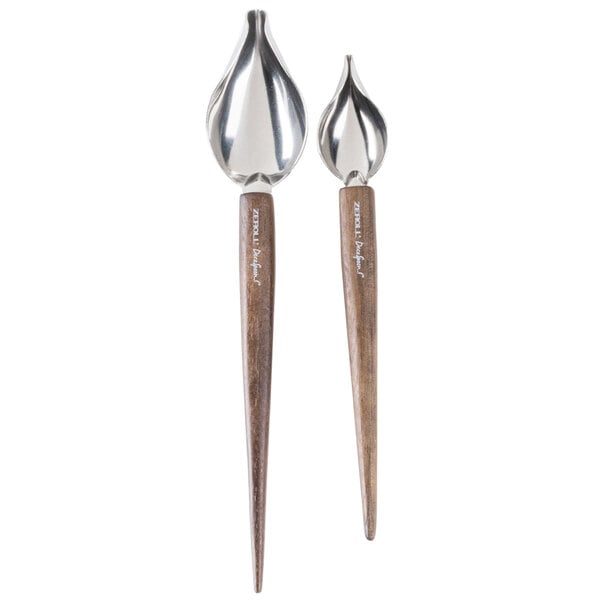 A close up of a pair of Zeroll stainless steel deco spoons with beech wood handles.