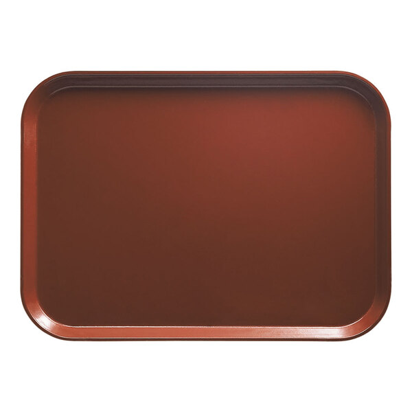 A rectangular real rust Cambro cafeteria tray on a table.