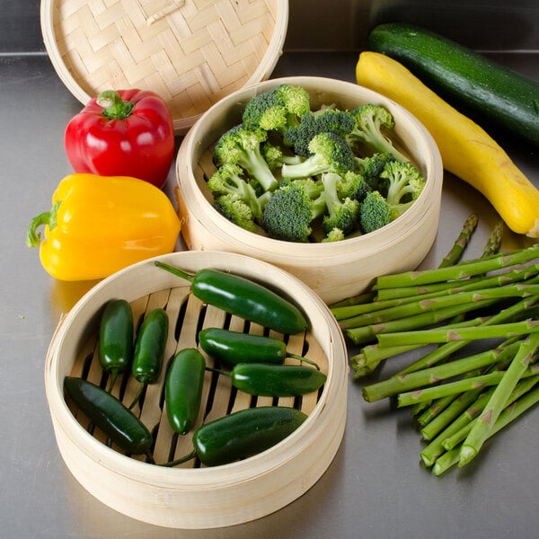 Town 34208 Bamboo Steamer Set with broccoli and jalapenos steaming over vegetables.