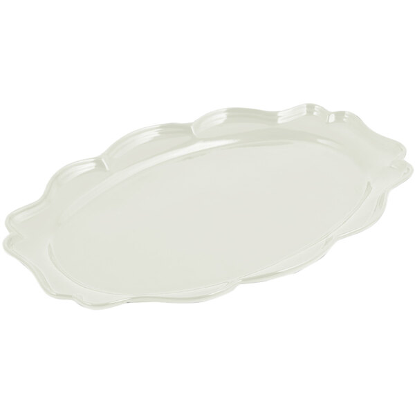A white oval Bon Chef platter with a scalloped edge.