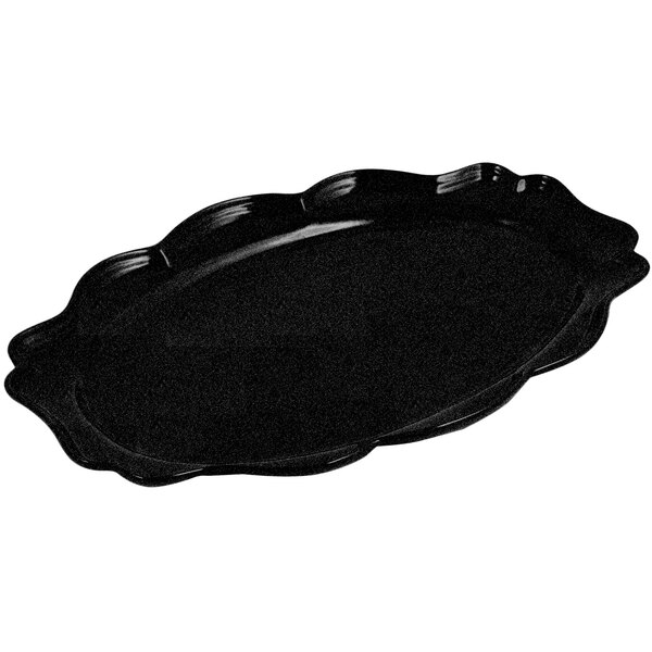 A black oval shaped Bon Chef tray with a scalloped edge.