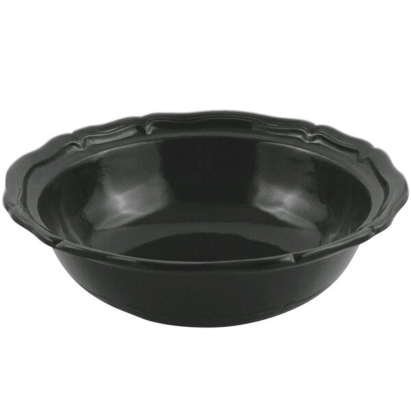 A black bowl with a scalloped edge.
