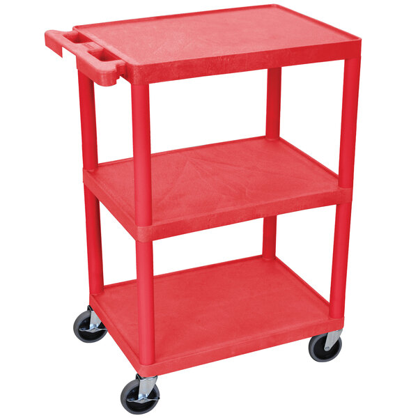 A red Luxor plastic utility cart with three shelves and wheels.