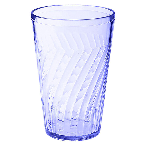 A clear plastic tumbler with a blue wavy pattern on the bottom.