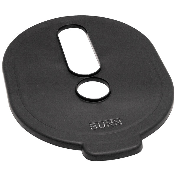 A black plastic Bunn Brew Thru lid with a hole in it.