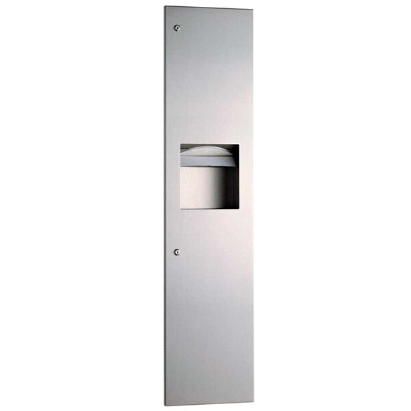 A rectangular stainless steel Bobrick paper towel dispenser with a lid.