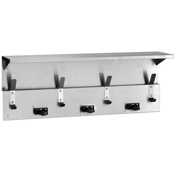 A stainless steel wall mounted Bobrick utility shelf with mop and broom holders and rag hooks.