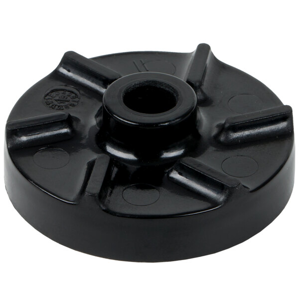 A black round plastic disc with holes.