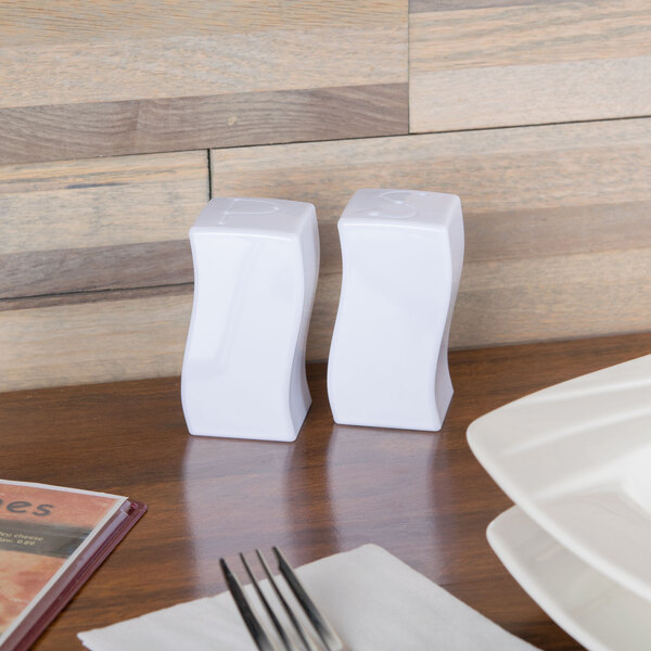 A white Fineline Tiny Temptations salt and pepper shaker set on a table.