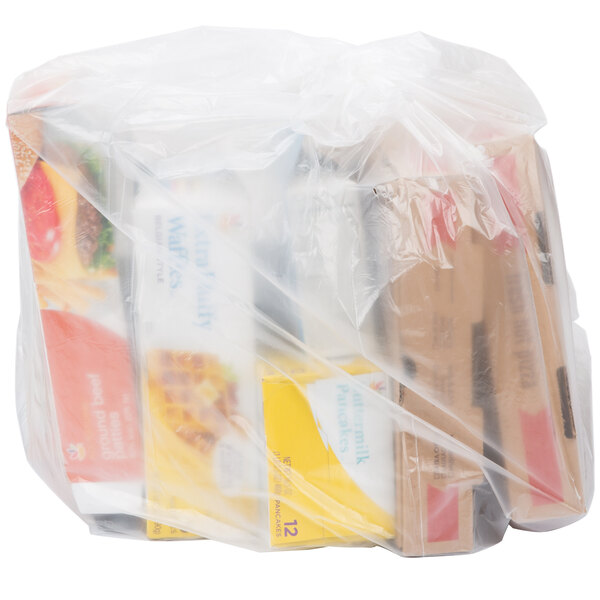 A white plastic trash bag filled with food items.