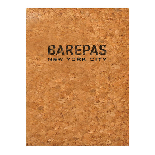 A close up of a natural cork menu cover with black text.