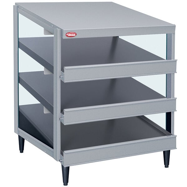 A grey metal Hatco countertop pizza warmer with three shelves and glass doors.
