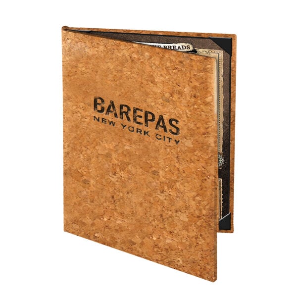 A Menu Solutions natural cork menu cover with cards inside.