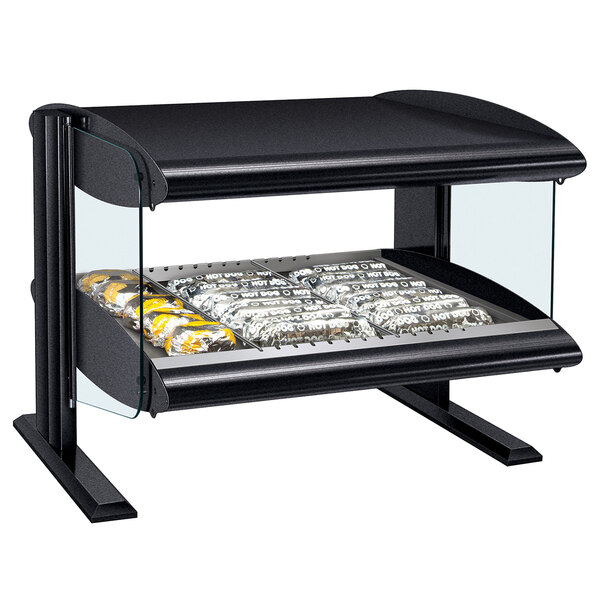 A black Hatco countertop food warmer with double shelves holding a tray of food.