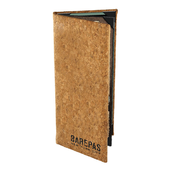 A cork menu cover with black text on it.